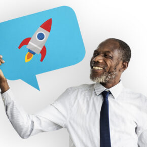 Happy man holding rocket symbol